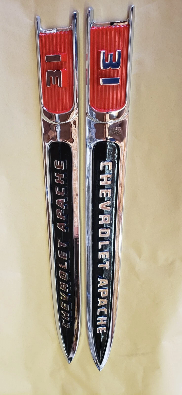 1959 Chevrolet Apache 3100 fender emblems showing restored red and black details