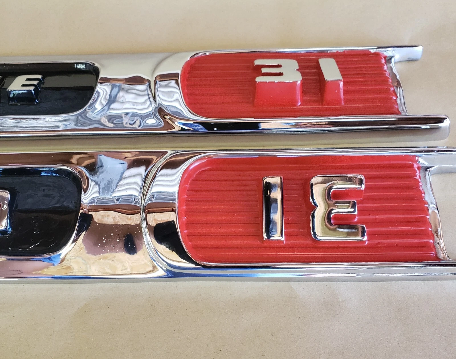 Restored 1959 Chevy Apache 3100 red fender emblem detail