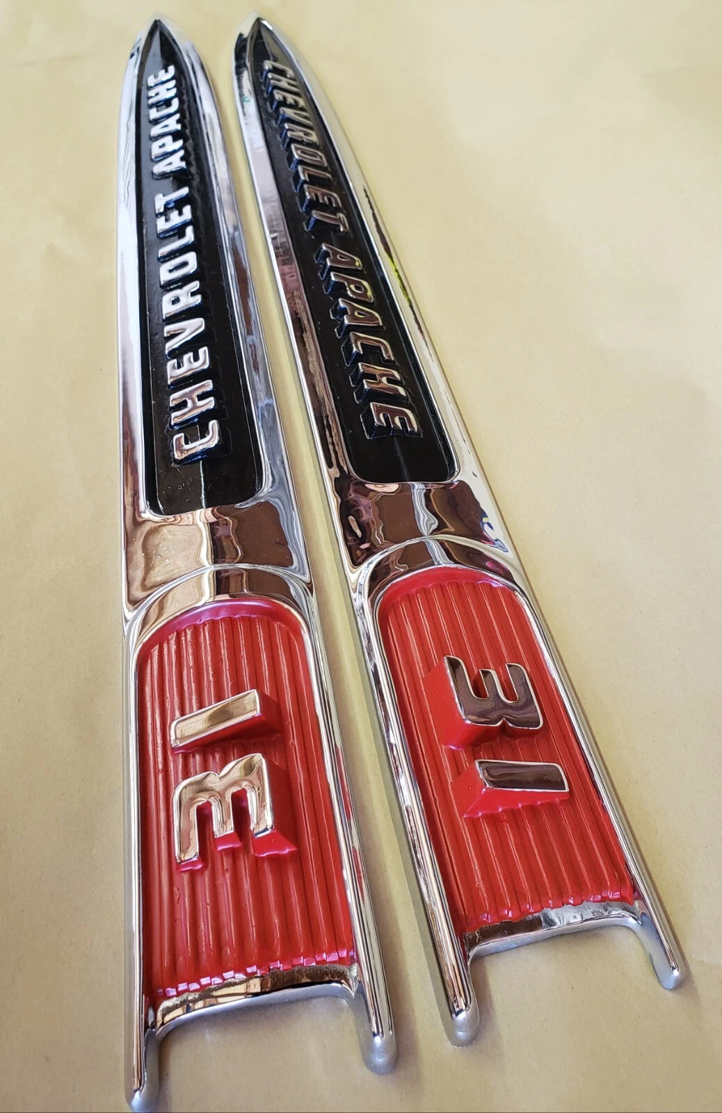 Pair of original restored 1959 Chevy Apache 3100 fender emblem spears