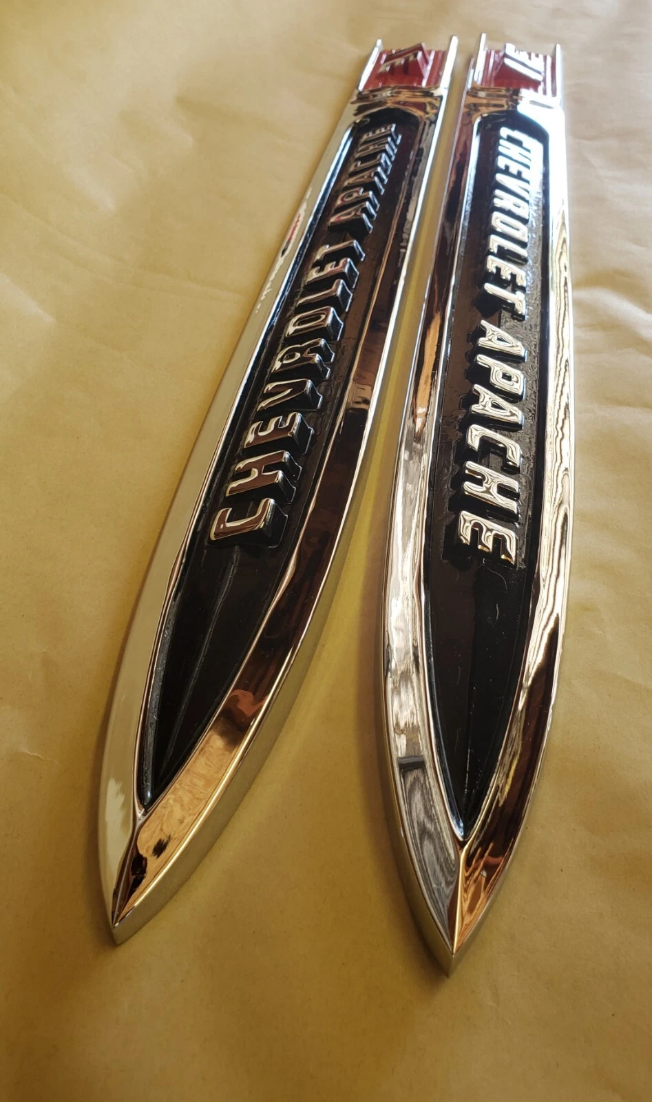 Close up of original 1959 Chevrolet Apache fender spear chrome and lettering