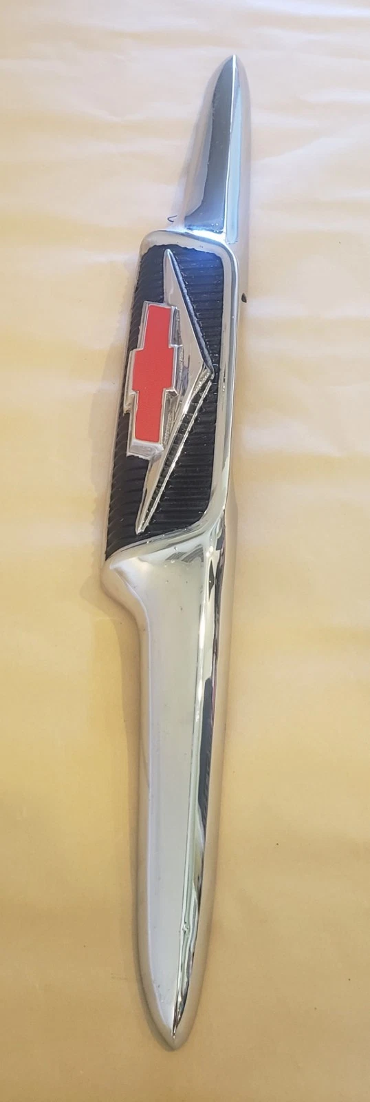 1958 Chevy Apache original V8 hood emblem restored front view