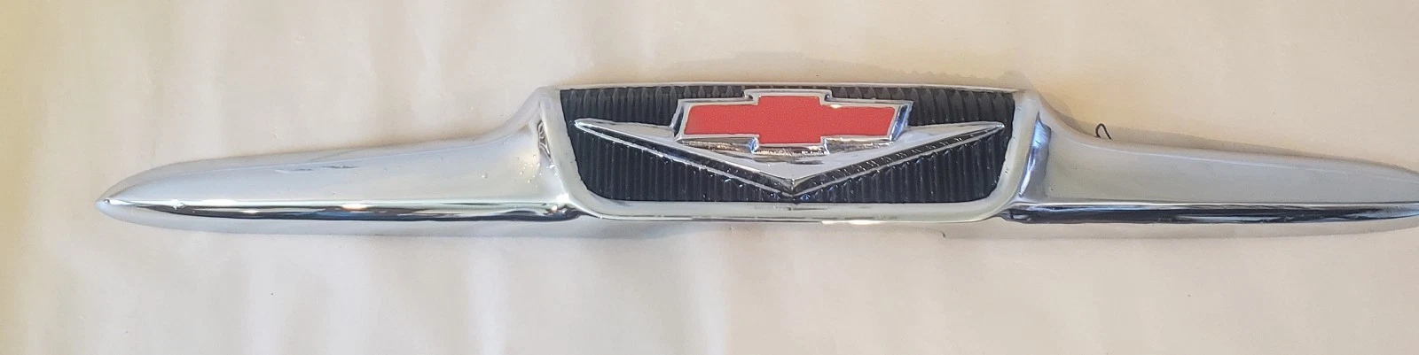 1958 Chevrolet V8 hood emblem restored bowtie and V8 detail